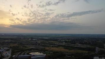 High Angle Aerial View footage over Windmill Wind Turbine at Stewartby Lake of England at Sunrise photo