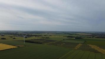 Aerial footage High Angle view of Green Energy natural Generators Sources of Wind turbines and solar panels Farms at England UK photo