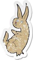 retro distressed sticker of a cue cartoon rabbit vector