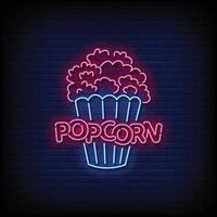 Neon Sign popcorn with Brick Wall Background Vector