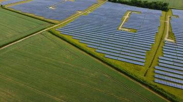 Aerial footage High Angle view of Green Energy natural Generators Sources of Wind turbines and solar panels Farms at England UK photo