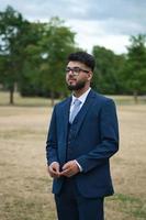 Young Businessman is posing at local park of Luton England UK photo