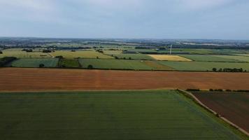 Aerial footage High Angle view of Green Energy natural Generators Sources of Wind turbines and solar panels Farms at England UK photo