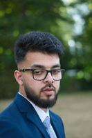 Young Businessman is posing at local park of Luton England UK photo