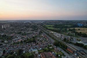 Gorgeous Aerial View of Luton City of England UK at Sunset Time, Colourful Clouds high angle footage taken by drone photo