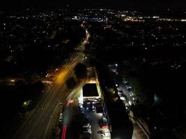 Beautiful Aerial High Angle View of British Motorways and Traffic at Luton Town of England UK at Night after Sunset photo