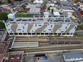 Most Beautiful Aerial View of City centre Buildings and Central Railway Station of Luton Town of England, Train on Tracks photo