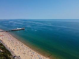 High Angle Sea View Beach Front with People at Bournemouth City of England UK, Aerial Footage of British Ocean photo