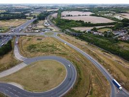 Aerial View and High Angle Footage of British Motorways Interchange of M1 Junction 11a at North Luton City of England UK. photo