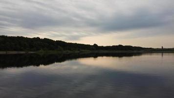 Aerial and High Angle Image Cute Water Birds are Swimming in the Stewartby Lake of England UK on Beautiful Early Morning at Sunrise photo