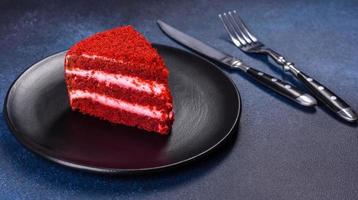 Red velvet cake, classic three layered cake from red butter sponge cakes with cream photo