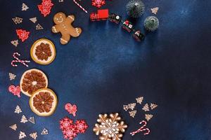 Christmas homemade gingerbread cookies on a dark concrete table photo