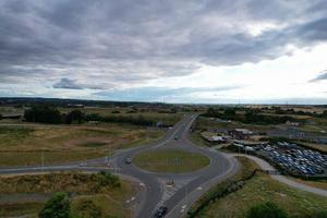 Aerial View and High Angle Footage of British Motorways Interchange of M1 Junction 11a at North Luton City of England UK. photo