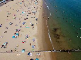 High Angle Sea View Beach Front with People at Bournemouth City of England UK, Aerial Footage of British Ocean photo