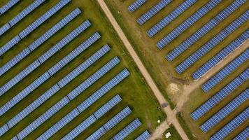 Aerial footage High Angle view of Green Energy natural Generators Sources of Wind turbines and solar panels Farms at England UK photo
