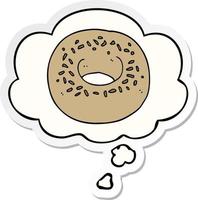 cartoon donut and thought bubble as a printed sticker vector