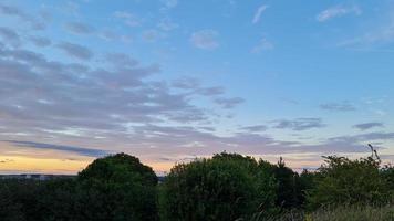 Beautiful and Colourful Sunset with Clouds on Sky photo