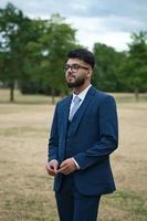 Young Businessman is posing at local park of Luton England UK photo