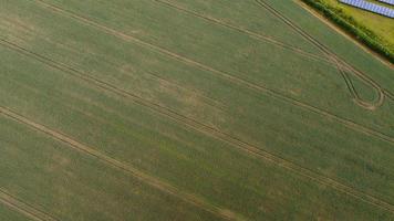 Aerial footage High Angle view of Green Energy natural Generators Sources of Wind turbines and solar panels Farms at England UK photo