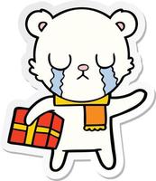 sticker of a crying polar bear cartoon with christmas gift vector