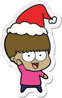 happy sticker cartoon of a boy waving wearing santa hat vector