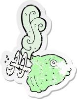 retro distressed sticker of a cartoon smelly old fish head vector