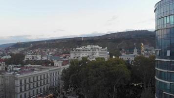 Tbilisi, Georgia , 2021 - Aerial rising view crowds of people in liberty square on democratic party Georgian dream political agitation event. Political powers in caucasus concept. Integration to EU video