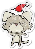 cute distressed sticker cartoon of a dog wearing santa hat vector