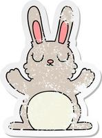 distressed sticker of a quirky hand drawn cartoon rabbit vector