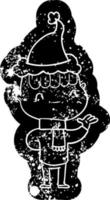 cartoon distressed icon of a friendly boy wearing santa hat vector