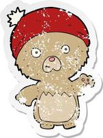 retro distressed sticker of a cartoon cute teddy bear in hat vector