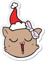 sticker cartoon of a cat face wearing santa hat vector