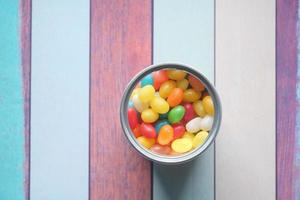 slow motion of Jelly beans in a container on table photo