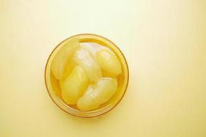 Homemade Mango Pickle in a glass jar on table , photo