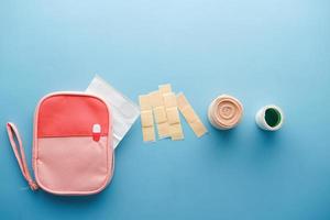 adhesive bandage and a bag on table photo