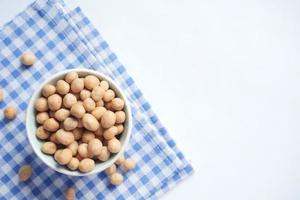 indonesia peanuts in a bowl on table top down . photo