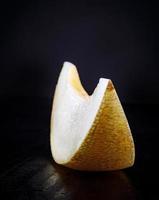 Beautiful slice of ripe melon on a wooden table. photo