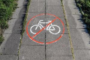 Painted bicycle signs on asphalt found in the city streets of Germany. photo