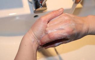 Cleaning and washing hands with soap prevention for outbreak of coronavirus covid-19 photo