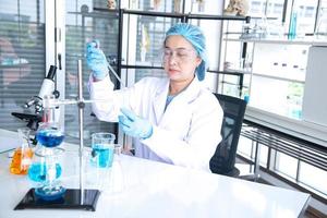 Asian woman scientist, researcher, technician, or student conducted research in laboratory photo