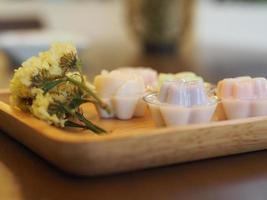 jelly desserts with a set of tea on the table. photo