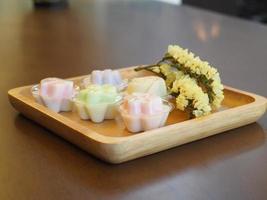 jelly desserts with a set of tea on the table. photo