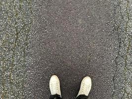 View from above on a man's feet on the road 2 photo