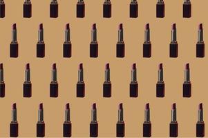 Close-up of lipstick on brown background with cut path photo