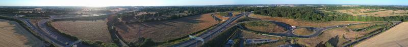 High Angle View of Luton Airport Junction Interchange of Motorways M1 J10 at Luton City of England UK. it is Connection Luton City and London Luton Airport Image Created on 11th August 2022 with Drone photo