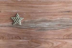 Gold star on wood top view photo