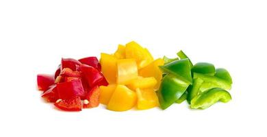 Green yellow red chopped sweet bell pepper isolated on white background photo