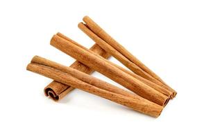 cinnamon sticks isolated on white background photo