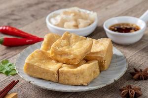 Deep fried stinky tofu with pickled cabbage street food in Taiwan. photo