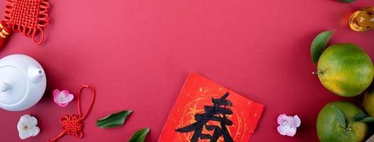 Top view of fresh tangerine mandarin orange on red background for Chinese lunar new year. photo